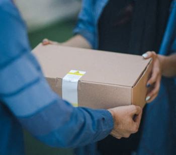 A box is delivered as part of a concierge package-acceptance service